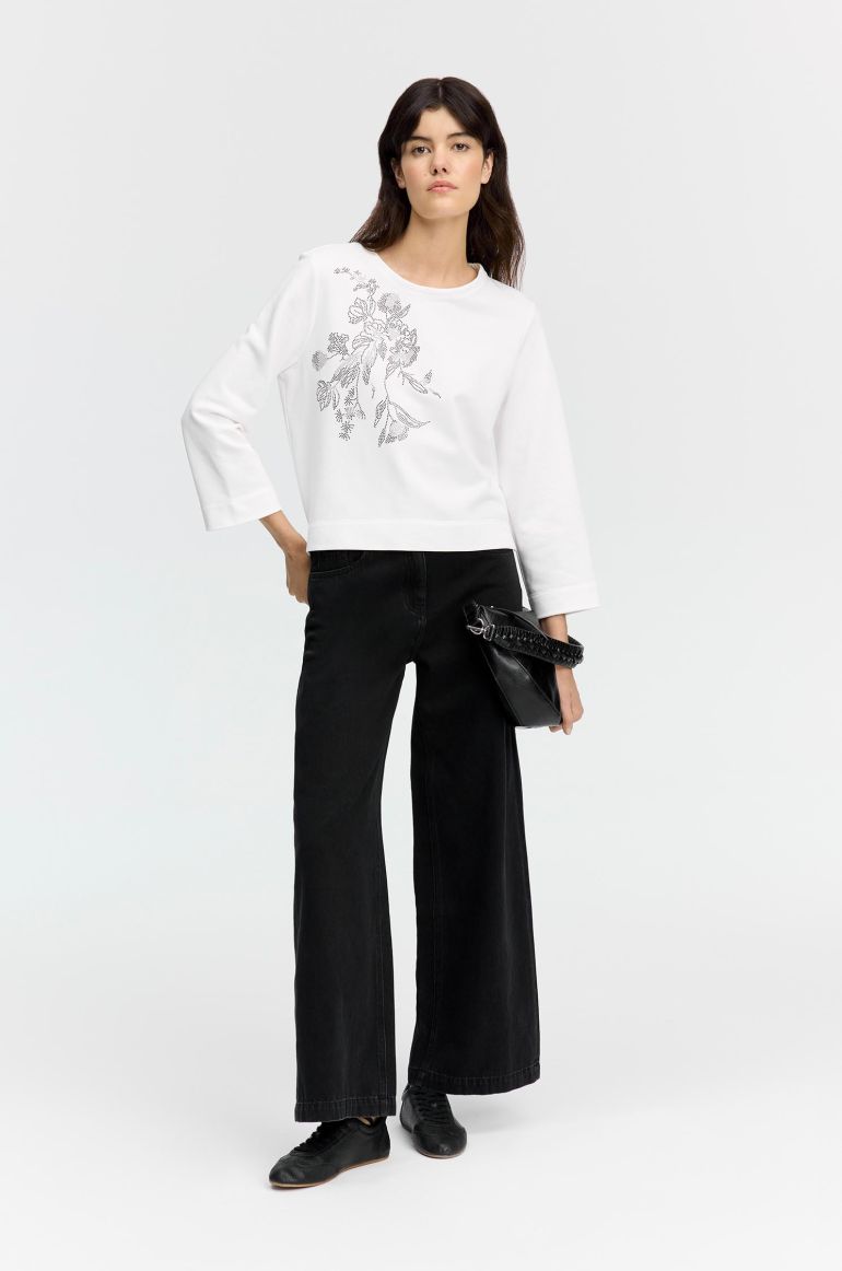 Bluza z połyskującą aplikacją