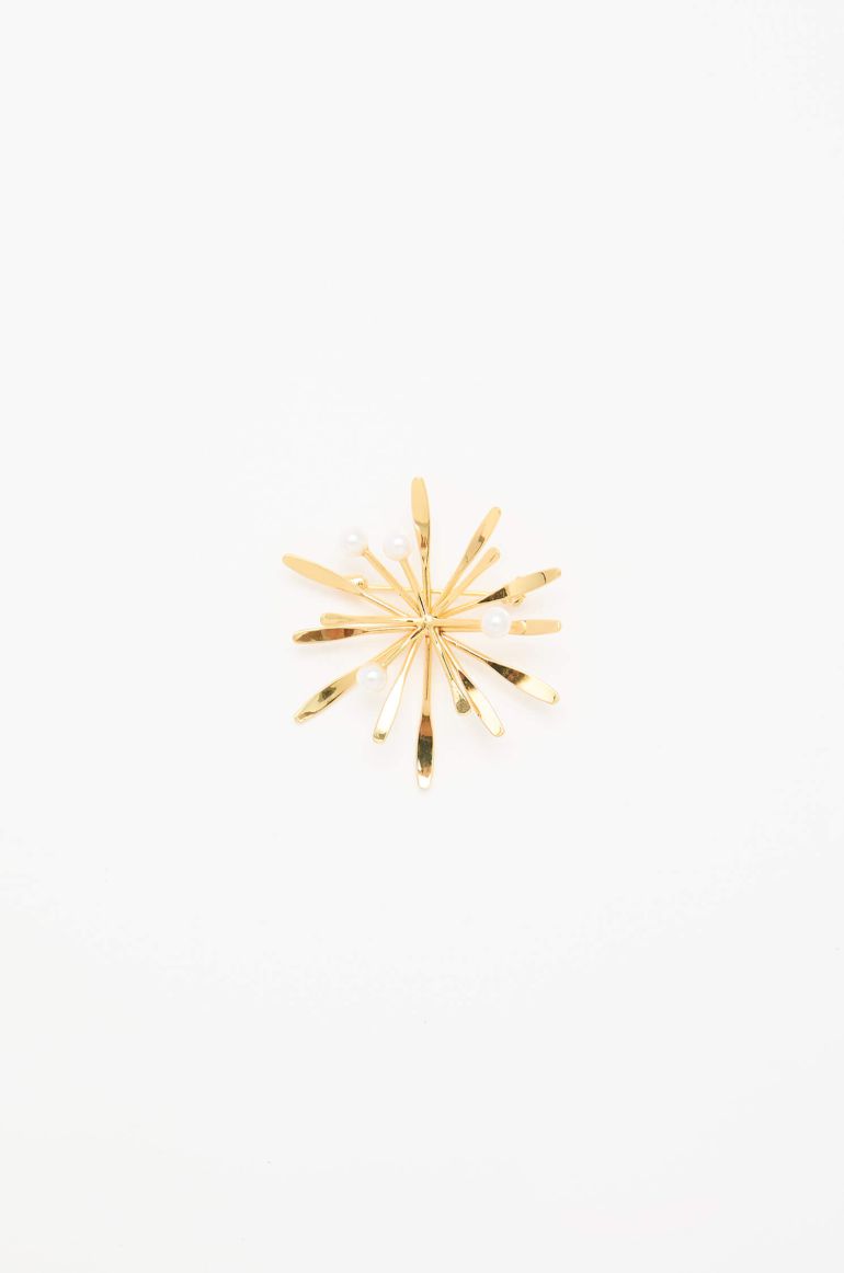 Broszka z motywem promieni