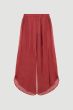 Terakotowe spodnie o asymetrycznym kroju Solar Obraz 4